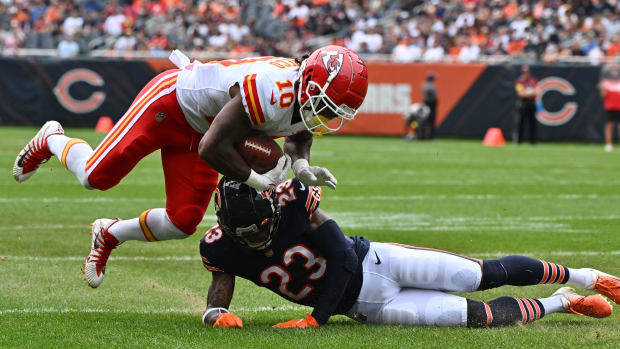 Aug 13, 2022; Chicago, Illinois, USA; Kansas City Chiefs running back Isiah Pacheco (10) is taken down by Chicago Bears defensive back Lamar Jackson (23) in the first quarter at Soldier Field. Mandatory Credit: Jamie Sabau-USA TODAY Sports